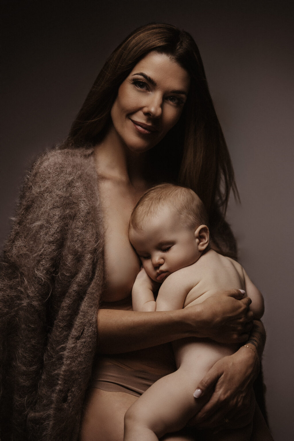 Mamm am Mohair, Baby schléift um Aarm